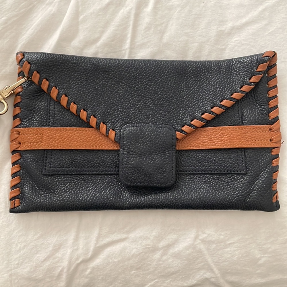 Below the Belt brand  leather clutch with strap